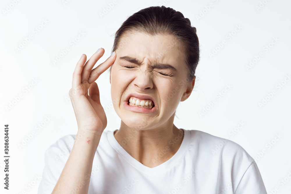 young man with hands on his face young man with hands on his face