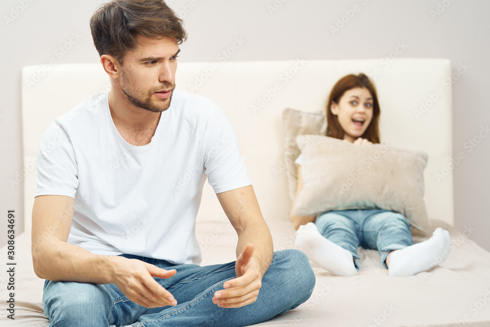 couple sitting on sofa watching tv couple sitting on sofa watching tv