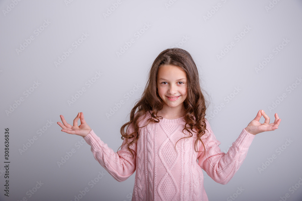 cheerful toothy shining girl meditating doing yoga isolated on a white background cheerful toothy shining girl meditating doing yoga isolated on a white background