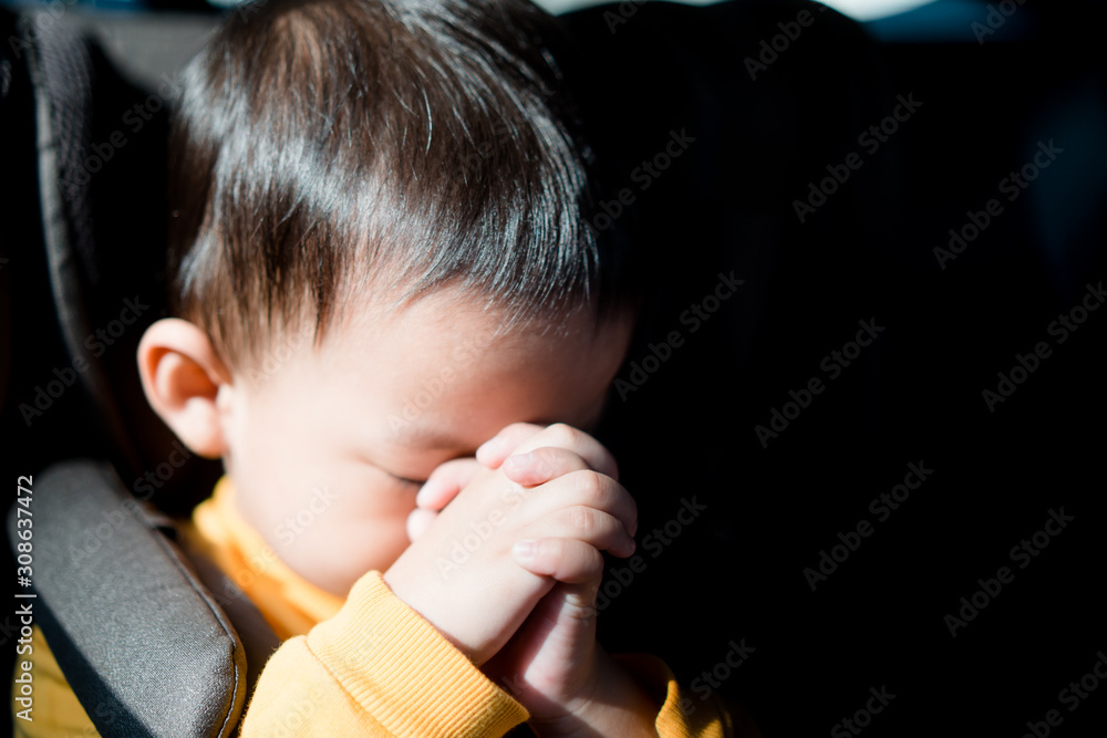 Little toddler boy praying and worship to GOD in his car for safe trip ...