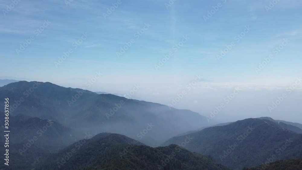 Panning shot hazy neighboring valleys near Mt Baldy in southern California Panning shot hazy neighboring valleys near Mt Baldy in southern California