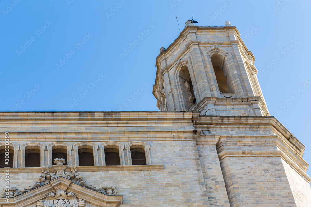 Massive Girona's Cathedral facade with high tower bell