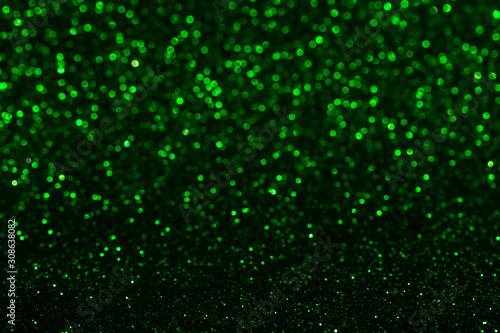 defocused green sparkles, lights blurred background, bokeh.