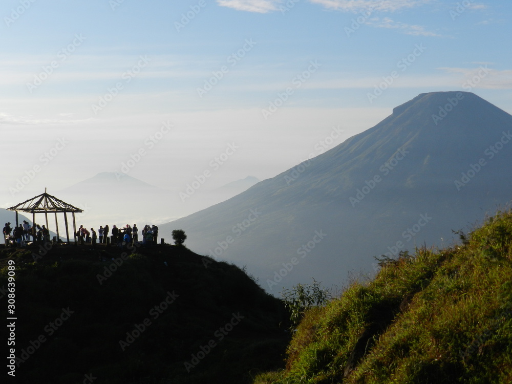 INDONESIA. SEPTEMBER 09, 2014. Camping trip tent on holiday,  Adventures Camping tourism and tent with beautiful sunrise in place for camping at Hill Sikunir.