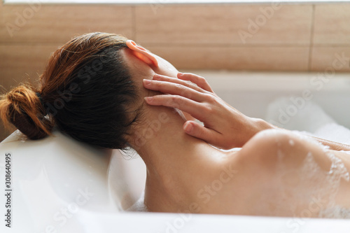 woman washing her hair in bathroom