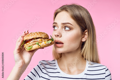 young woman with hamburger