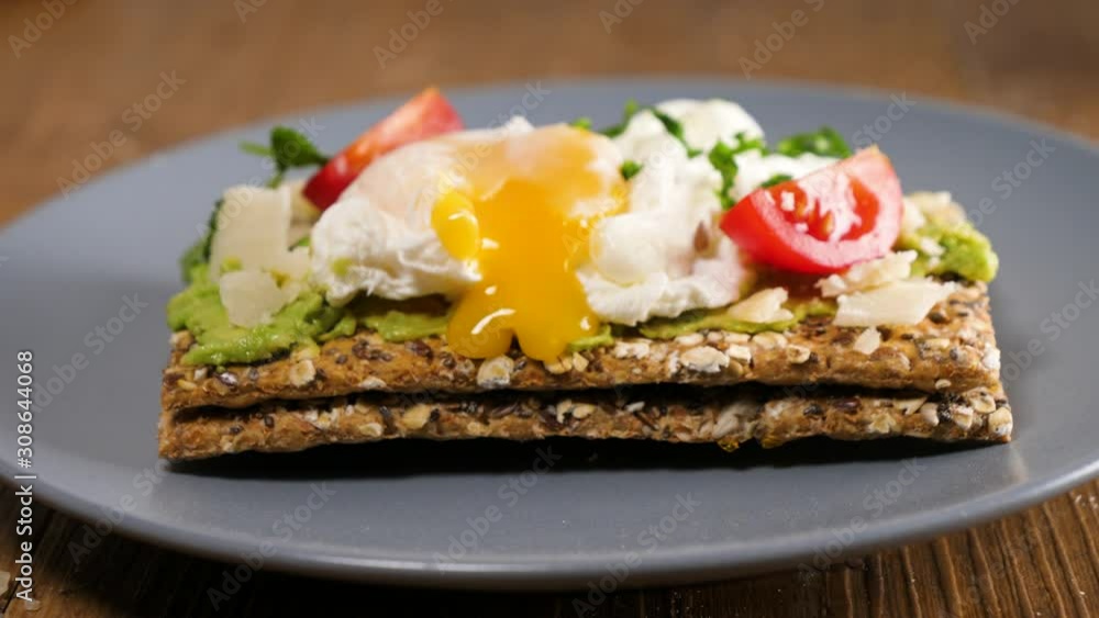 poached egg on bread slices with avocado and tomato poached egg on bread slices with avocado and tomato