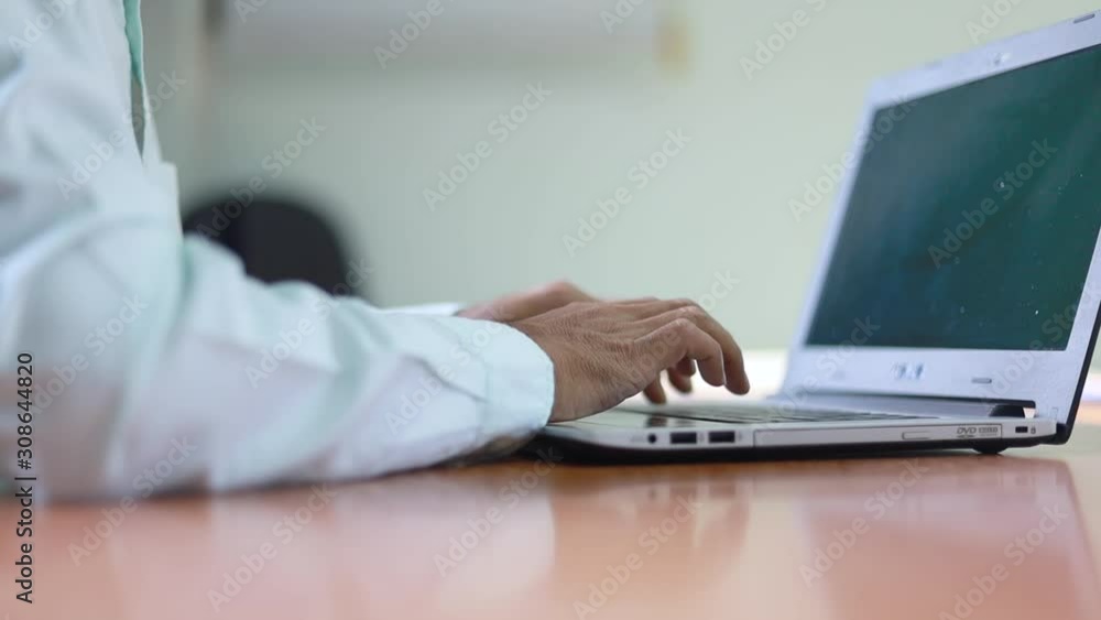 Close up Man hands typing with fingers on computer laptop Close up Man hands typing with fingers on computer laptop