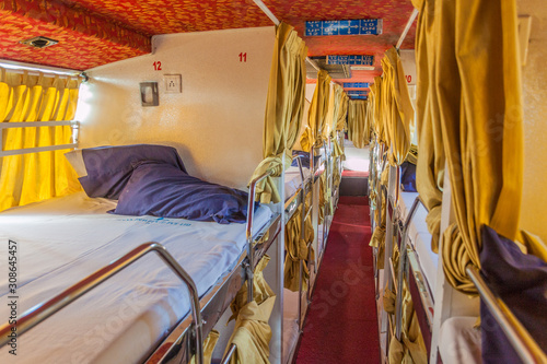 BHOPAL, INDIA - FEBRUARY 5, 2017: Interior of a sleeper bus in India photo