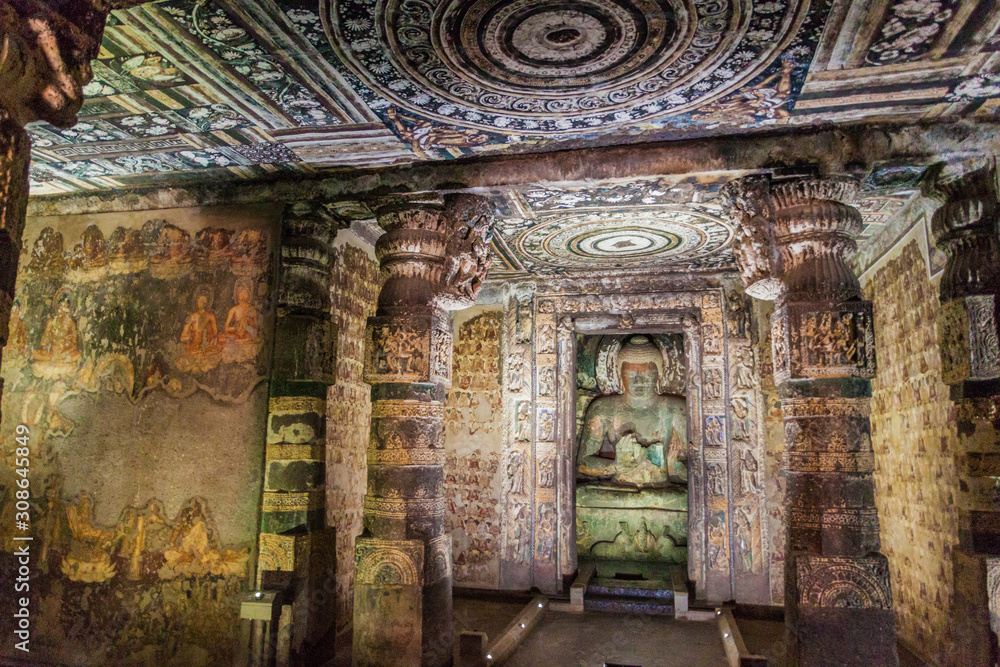 Fototapeta premium AJANTA, INDIA - FEBRUARY 6, 2017: Interior of a Buddhist cave carved into a cliff in Ajanta, Maharasthra state, India