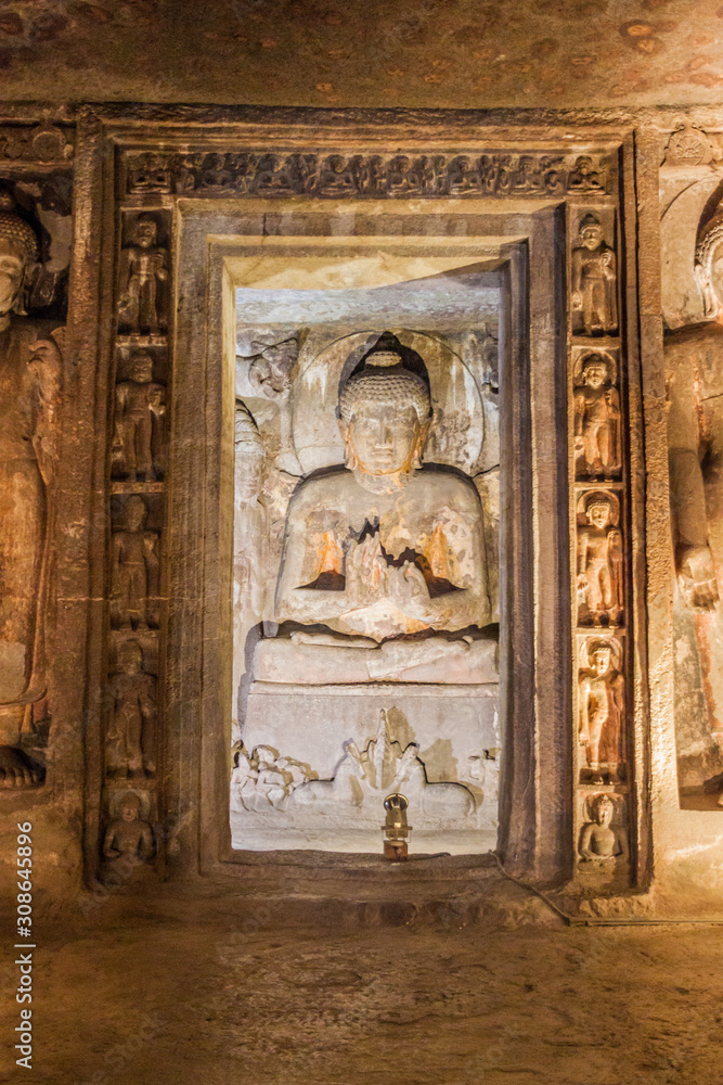 AJANTA, INDIA - FEBRUARY 6, 2017: Buddha image in a Buddhist cave carved into a cliff in Ajanta, Maharasthra state, India