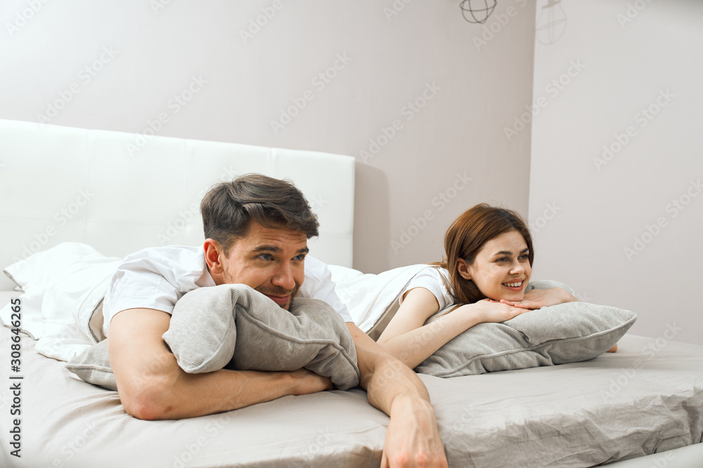 Fototapeta premium couple lying on bed