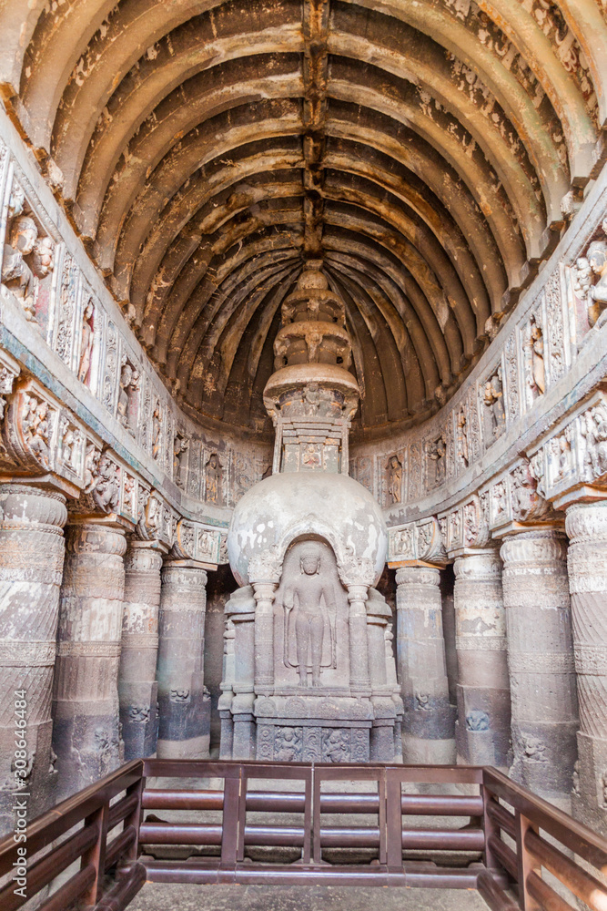 AJANTA, INDIA - FEBRUARY 6, 2017: Interior of the Buddhist chaitya (prayer hall), cave 19, carved into a cliff in Ajanta, Maharasthra state, India