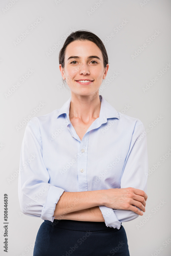 Happy young elegant businesswoman in white shirt standing in front of camera Happy young elegant businesswoman in white shirt standing in front of camera