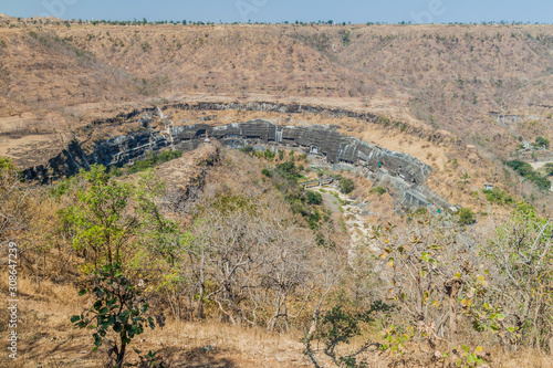 Buddhist caves carved into a cliff in Ajanta, Maharasthra state, India photo