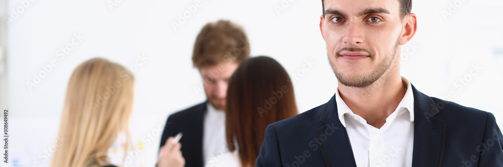 Smiling handsome cheerful man offer hand as hello Smiling handsome cheerful man offer hand as hello