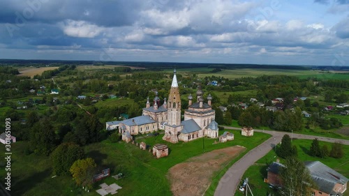 View of old churches in the village Parsky, cloud September day (aerial video). Ivanovo region, Russia   photo