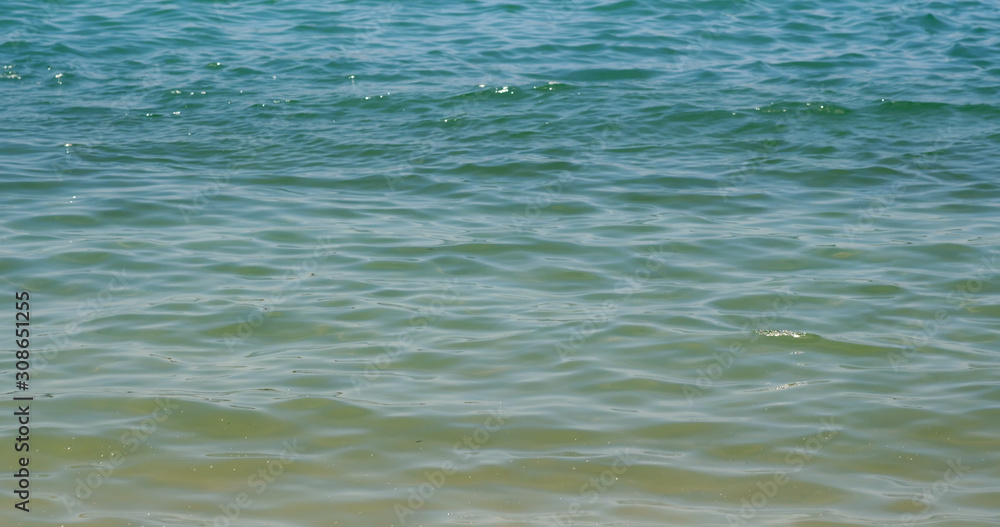 Beautiful sandy beach with clear blue water Beautiful sandy beach with clear blue water