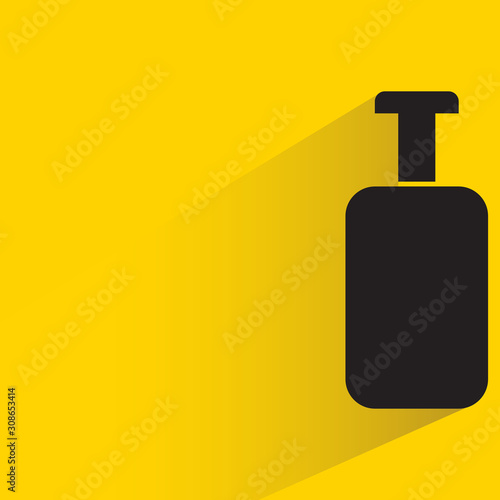beverage, alcohol bottle with drop shadow yellow background