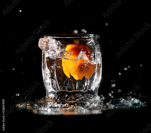 tangerine fruit in water with spray