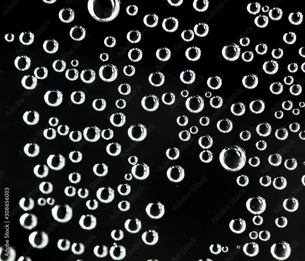 Air balls in water on a black background Air balls in water on a black background