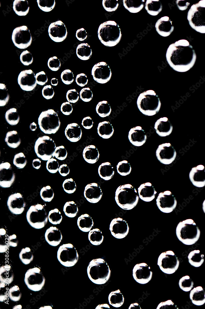 Air balls in water on a black background Air balls in water on a black background