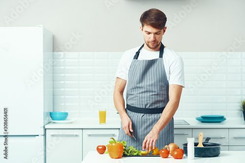 man preparing food in the kitchen