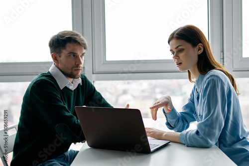 businessman and businesswoman working together in office
