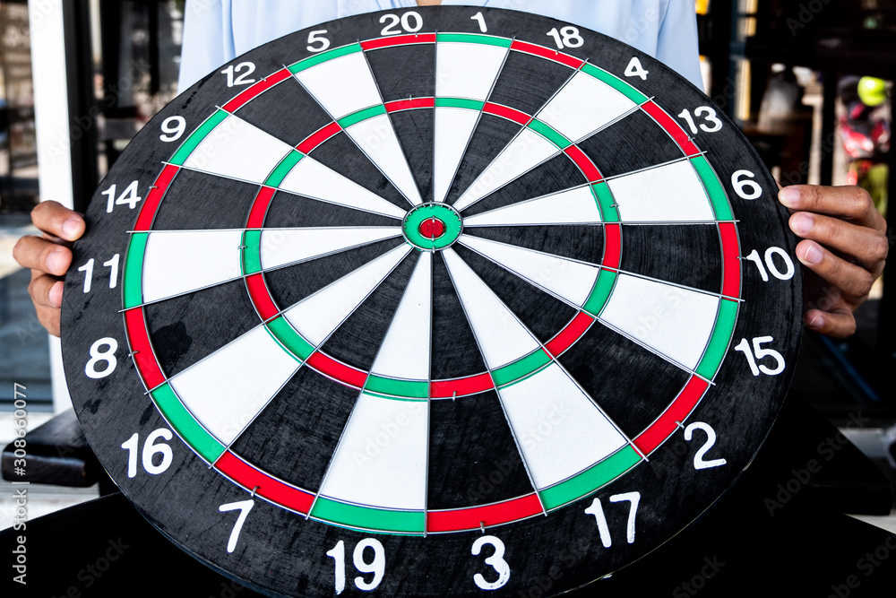 Young business women holding dartboard, Planning new business target and goals Young business women holding dartboard, Planning new business target and goals