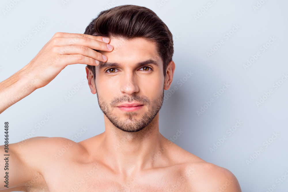 Closeup photo of macho guy perfect neat beard looking mirror touch forehead check skin condition salon procedure prevent wrinkles naked torso body isolated grey background Closeup photo of macho guy perfect neat beard looking mirror touch forehead check skin condition salon procedure prevent wrinkles naked torso body isolated grey background