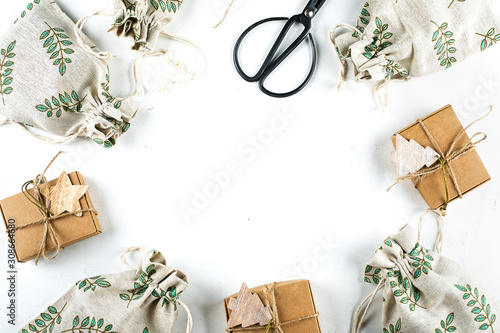 Christmas Flat lay. Zero Waste Gift Wrapping Holiday Season Eco-friendly Lifestyle. Craft Boxes and Pouches on white background. Top view, flat lay, copy space, mockup concept