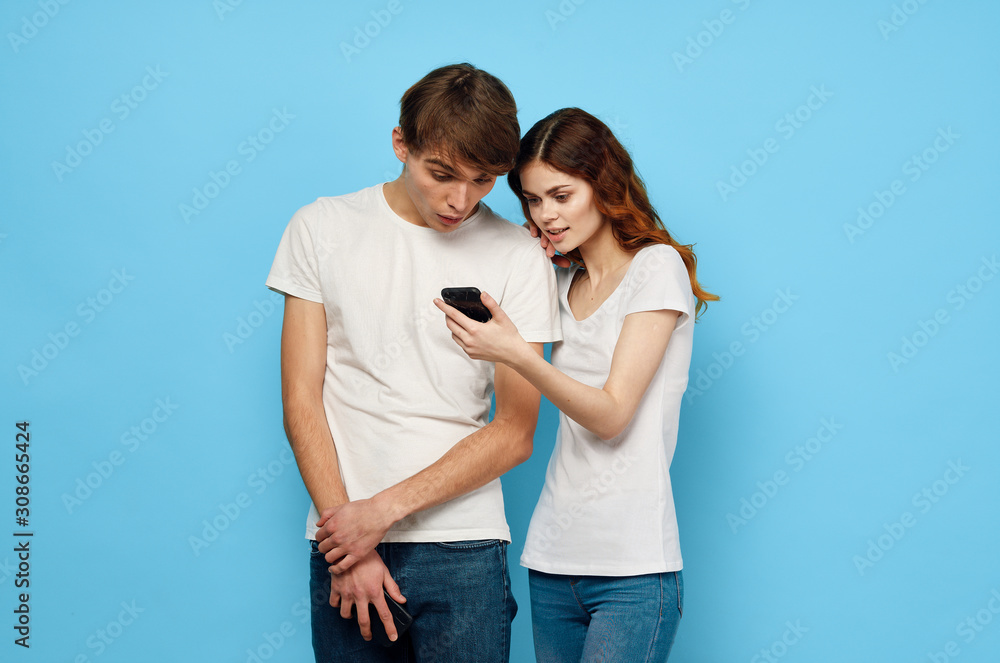 Fototapeta premium young couple in t-shirts chatting