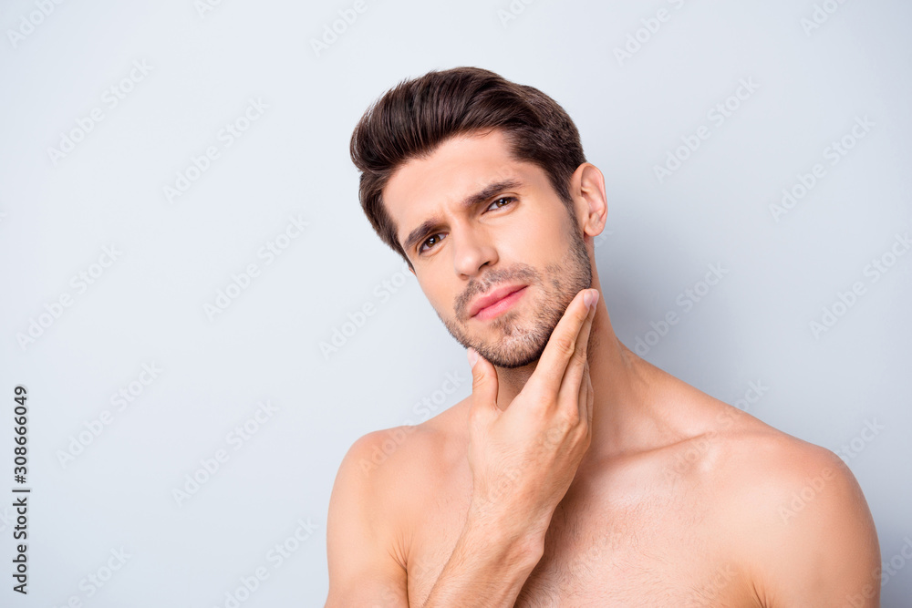 Obraz premium Close up photo of serious mascular guy look mirror touch chin hand expert man skincare spa salon procedure isolated over grey color background