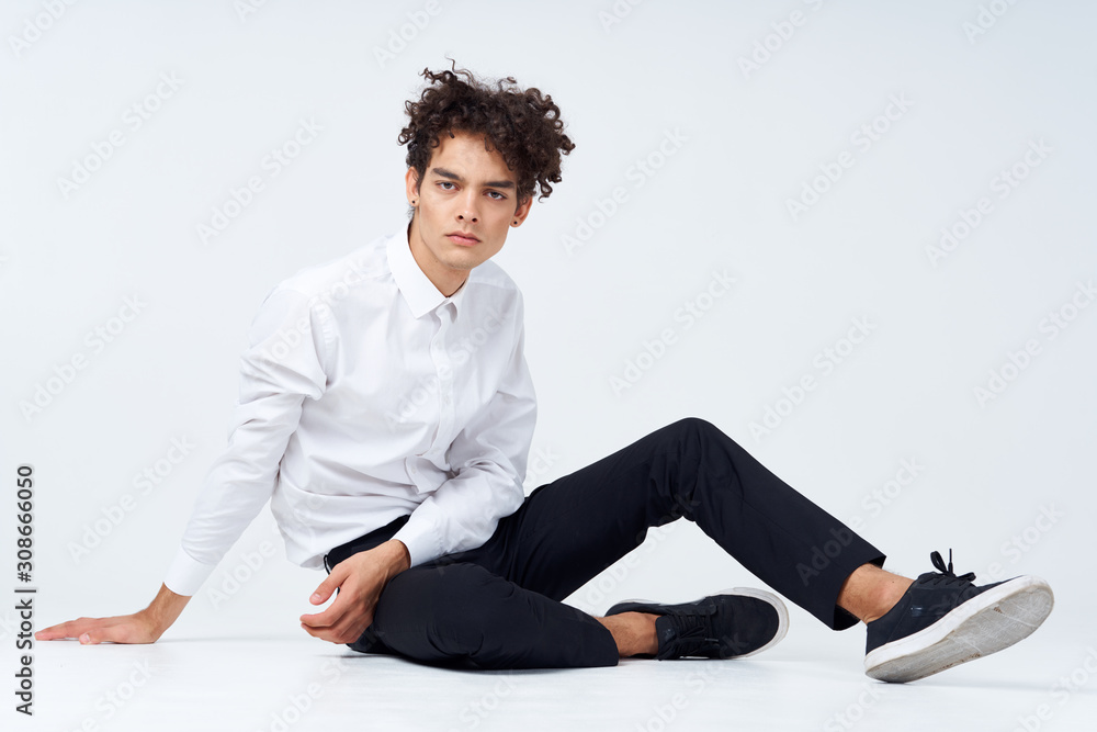 Fototapeta premium young man sitting on the floor