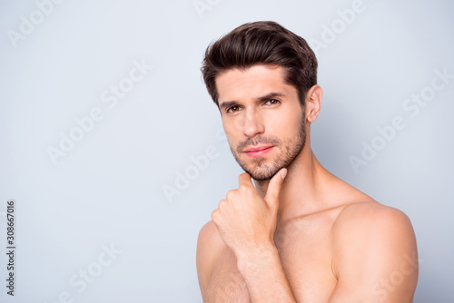 Close up photo of attractive focused guy look mirror touch unshaven chin skin need skincare cosmetics treatment isolated over grey color background