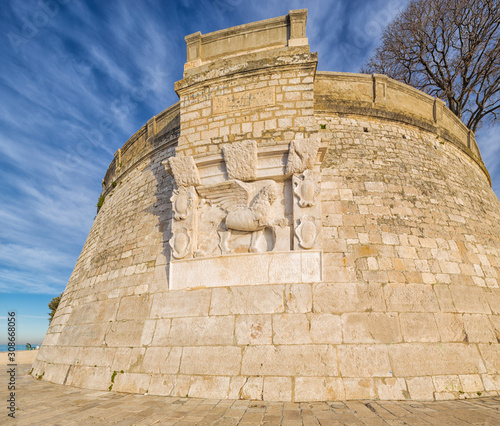 old venetian emblem in form of winged lion on the corner of ancient fortification around Zadar, Croatia. photo