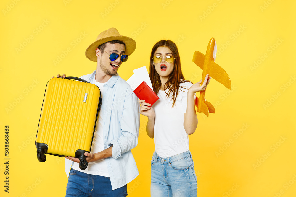 couple painting wall with paint roller couple painting wall with paint roller