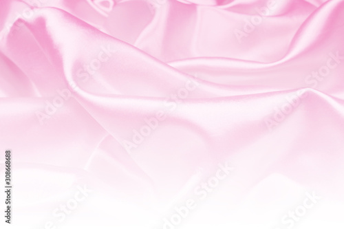 Beautiful pink satin luxury cloth texture can use as wedding background, fabric