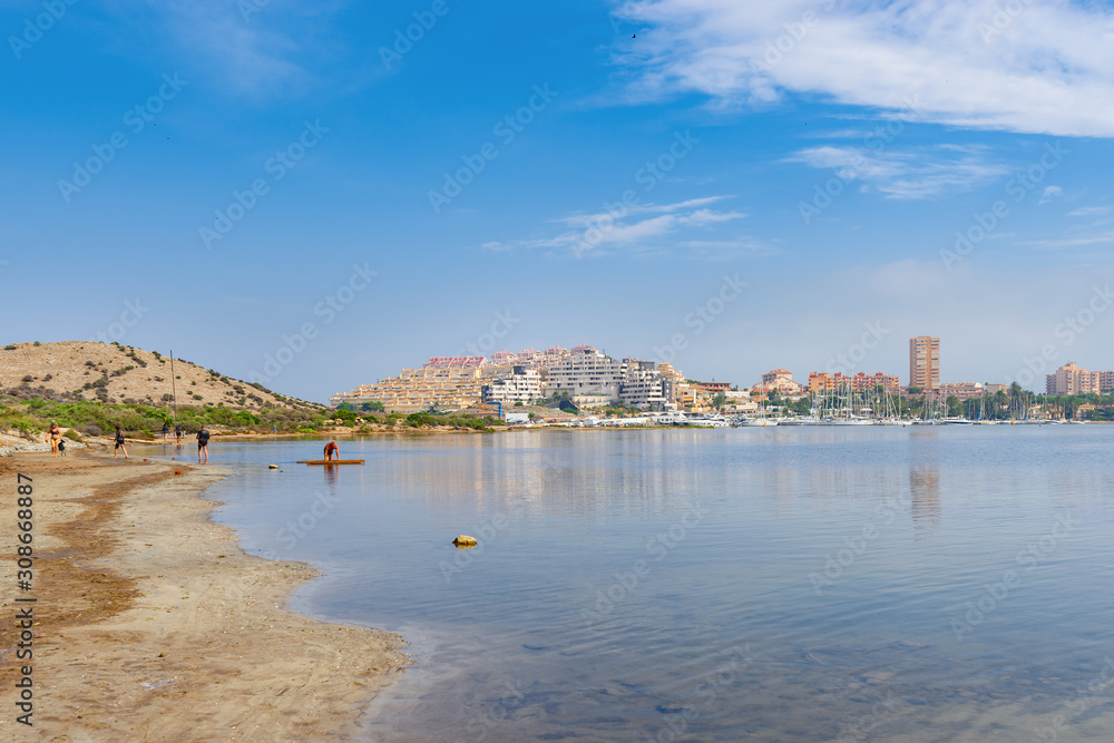 A mud Bay, where the people relax and take mud baths on the seashore. La Manga del Mar Menor. Murcia, Spain