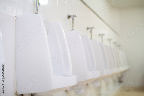 urinals in public restroom