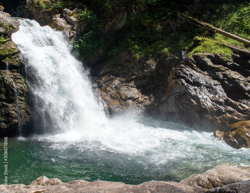 Thundering emerald colored punchbowl waterfall North Fork Sauk River Falls of the north cascades in a rocky gorge off Mountain Loop Highway in Darrington Snohomish county Washington State  photo