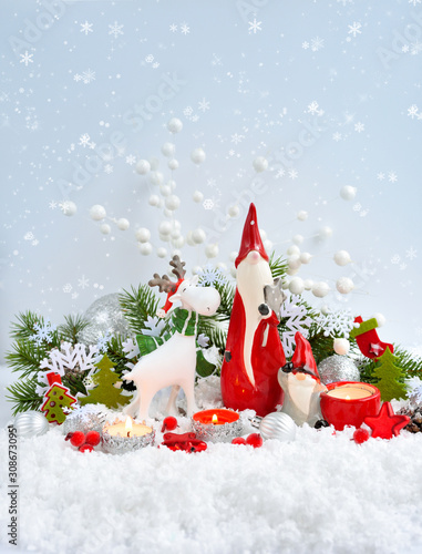 Christmas decorations cute figure elk and gnomes with festive decorations оn the snow. Christmas or New Year greeting card.