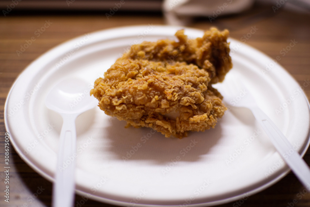 Fried chicken on a white plate, ready to eat fast food Fried chicken on a white plate, ready to eat fast food