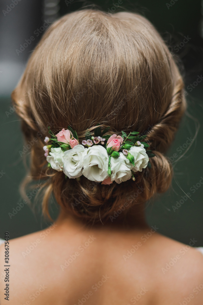 wedding preparations. Young beautiful bride getting her hairstyle, braiding  roses in hair Stock Photo - Alamy