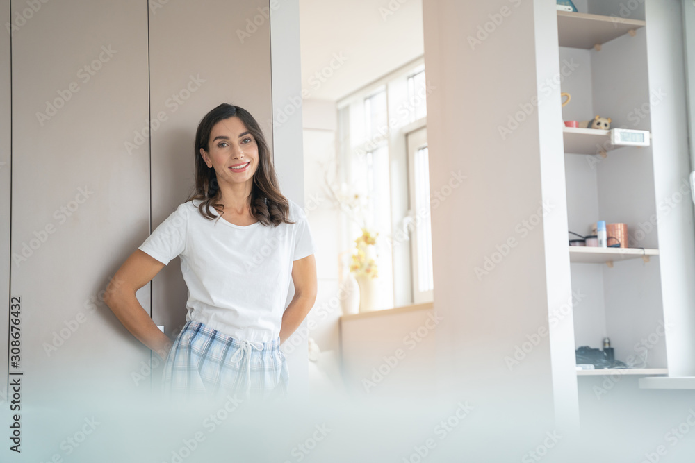 Beautiful smiling woman in the room alone stock photo Beautiful smiling woman in the room alone stock photo