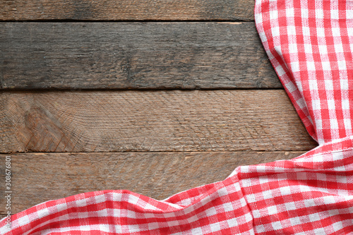 Table cloth on wooden table rustic background. Copy space for text, mock up. High resolution photography ready as a kitchen background.