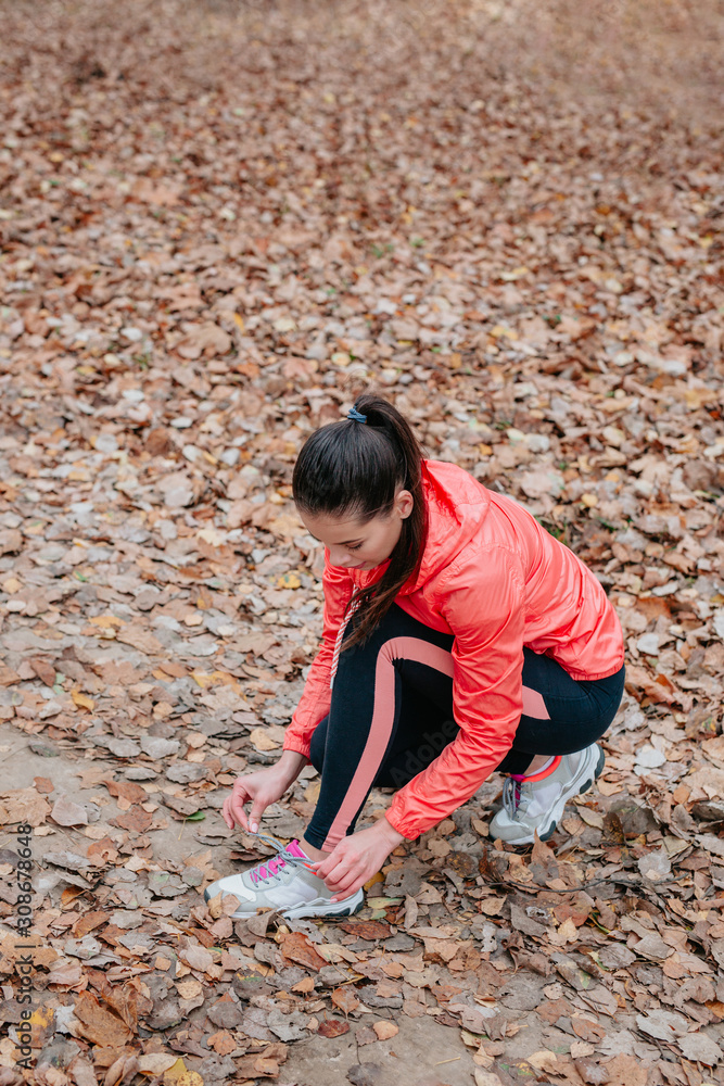 Female sport fitness runner getting ready for jogging outdoors Female sport fitness runner getting ready for jogging outdoors
