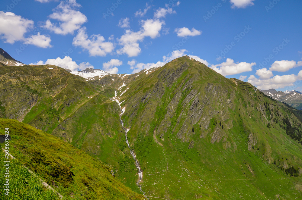 A scenic view of the San Bernardino Pass in Swiss Alps in summer. Mountains in summer.