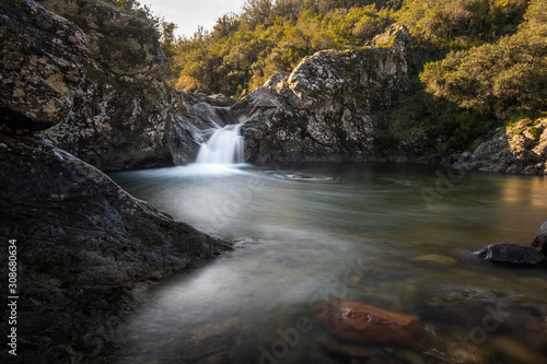 Mountain stream flowing into natural pool in Corsica © Jon Ingall