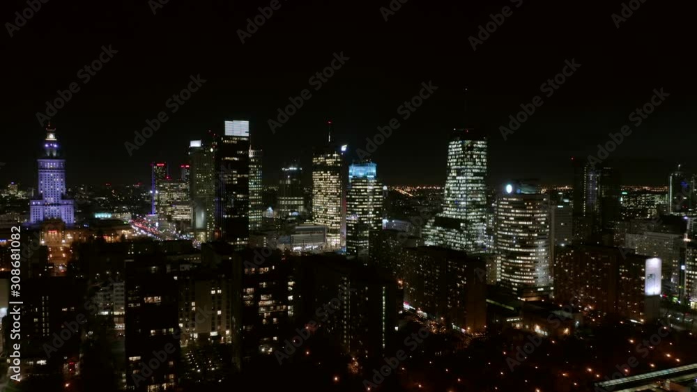 Warsaw Poland. 04. December. 2019. Aerial view of busy streets in downtown Warsaw in City, with bright night lighting. View of the night skyscrapers and streets in the business center of the city. Warsaw Poland. 04. December. 2019. Aerial view of busy streets in downtown Warsaw in City, with bright night lighting. View of the night skyscrapers and streets in the business center of the city.